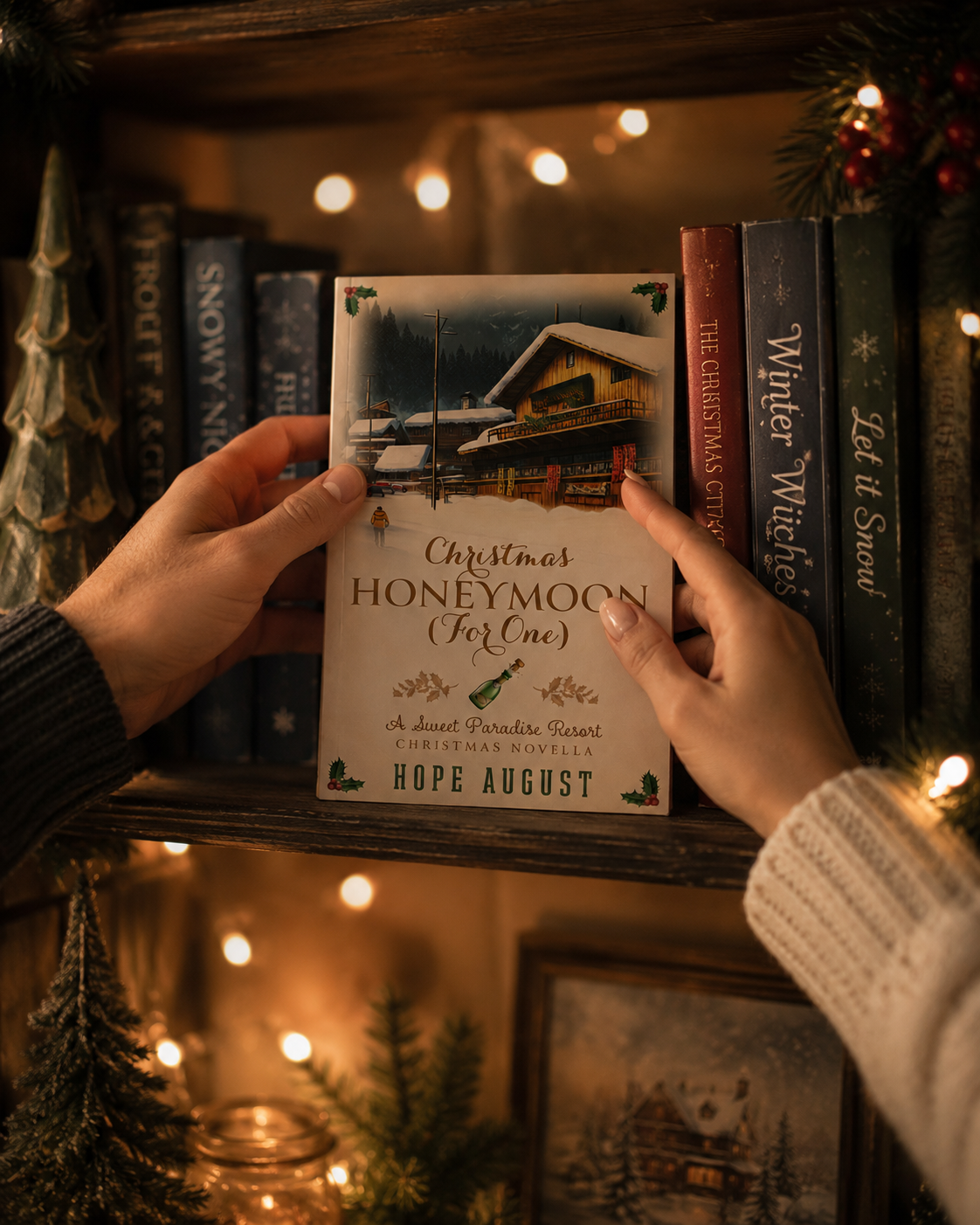 Person holding a book titled 'Christmas Honeymoon (For One)' by Hope August in a cozy setting with books and lights.