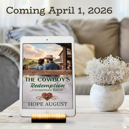 E-reader displaying 'The Cowboy's Redemption' by Hope August with a blurred living room background